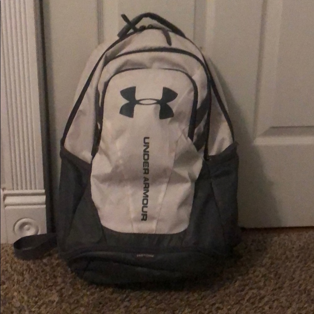 white and gray under armor backpack